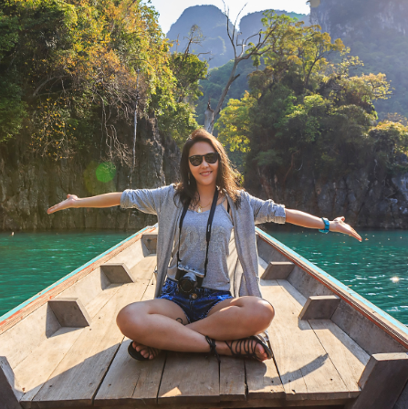 photo-of-woman-sitting-on-boat-spreading-her-arms-1371360